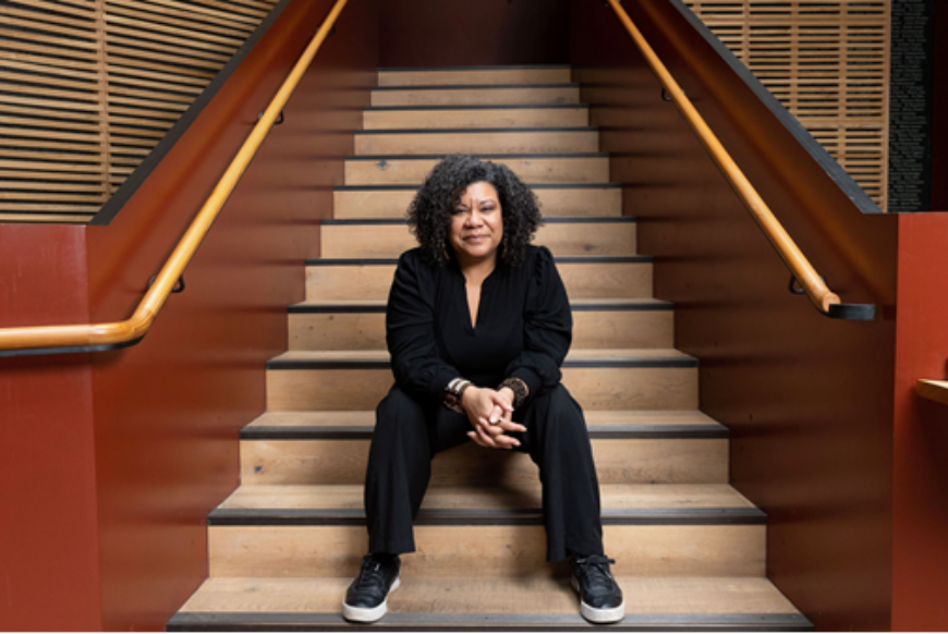 Nancy Medina sitting on the stairs at Bristol Old Vic